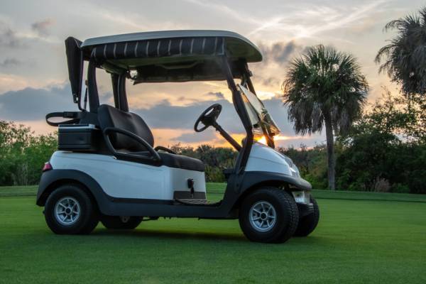 A golf cart on a course near Panama City Beach