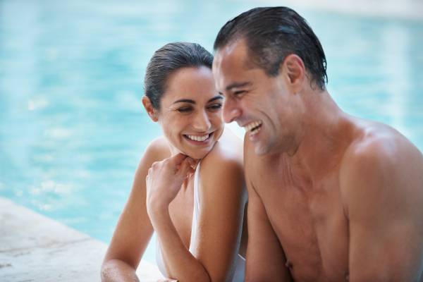 A couple enjoying the resort pool